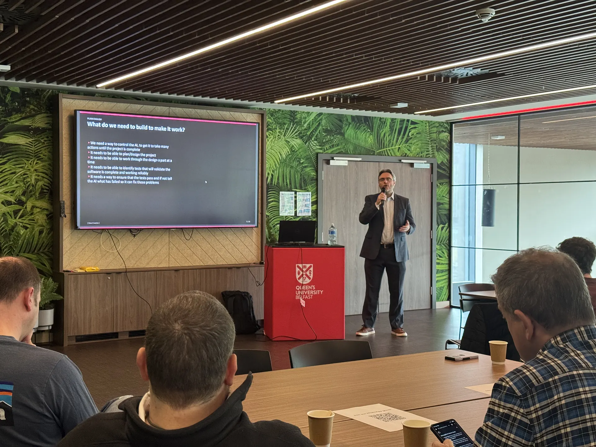 John Bustard speaking at the first FASE NI event in The Cube at Queen's Students' Union, Belfast